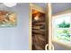 Bathroom features wood paneling, modern lighting, and a bright window view at 3317 S 100 E, Greenfield, IN 46140