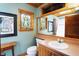 Bathroom featuring a stained glass window, light blue walls, and unique artistic details at 3317 S 100 E, Greenfield, IN 46140