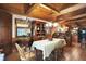 Charming dining room featuring wood ceilings, tile floors, and an open layout with a view of the kitchen at 3317 S 100 E, Greenfield, IN 46140