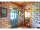 Charming entryway featuring colorful wallpaper, wood trim, and natural light creating a warm and inviting space at 3317 S 100 E, Greenfield, IN 46140