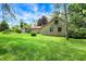 Expansive backyard featuring stone home and detached structure at 3317 S 100 E, Greenfield, IN 46140