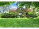 Charming stone home with a well-manicured lawn and mature trees at 3317 S 100 E, Greenfield, IN 46140