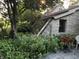 Beautiful stone home with a sunroom addition and landscaped garden at 3317 S 100 E, Greenfield, IN 46140