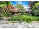 Charming stone home with lush greenery creating a private and picturesque setting at 3317 S 100 E, Greenfield, IN 46140