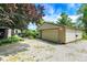 Spacious detached garage with gravel driveway and well maintained landscaping at 3317 S 100 E, Greenfield, IN 46140