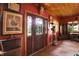 Unique hallway with hardwood ceiling and walls with doorway leading to outdoors at 3317 S 100 E, Greenfield, IN 46140