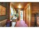 Hallway with a view to the bathroom, features a wood ceiling, and neutral walls with wood trim at 3317 S 100 E, Greenfield, IN 46140