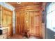 Hallway with wood ceilings, colorful wallpaper, and wood doors providing rustic charm and character at 3317 S 100 E, Greenfield, IN 46140
