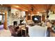 Spacious living room with a grand stone fireplace and wood-paneled ceiling at 3317 S 100 E, Greenfield, IN 46140
