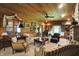 Inviting living room featuring hardwood ceiling, stone fireplace and cozy seating at 3317 S 100 E, Greenfield, IN 46140