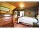 Bedroom with wood ceiling, four poster bed, and bright windows offering comfort and classic style at 3317 S 100 E, Greenfield, IN 46140