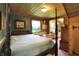 Bedroom featuring a four poster bed, wood ceilings, and tranquil decor, creating a peaceful retreat at 3317 S 100 E, Greenfield, IN 46140