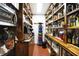 Functional pantry features wooden shelving stocked with goods and appliances for organized kitchen storage at 3317 S 100 E, Greenfield, IN 46140