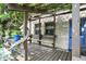 Charming patio with stone accents, wooden pergola and bench and climbing ivy at 3317 S 100 E, Greenfield, IN 46140