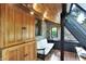 Stone accent wall and wood paneled ceiling feature in the sunroom with a bright window view at 3317 S 100 E, Greenfield, IN 46140