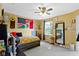 Bright bedroom featuring a unique flag on the wall, neutral carpets, and natural lighting at 3362 Pavetto Ln, Indianapolis, IN 46203