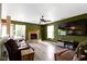 Comfortable Gathering room with a fireplace, wood floors, and a large window at 3362 Pavetto Ln, Indianapolis, IN 46203