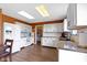 Updated kitchen featuring white cabinets, modern appliances, and wood floors at 3362 Pavetto Ln, Indianapolis, IN 46203