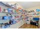 Spacious walk-in pantry with ample shelving and storage space for dry goods and appliances at 3362 Pavetto Ln, Indianapolis, IN 46203