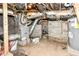 Unfinished basement featuring a water heater, furnace, and cement walls at 352 W 28Th St, Indianapolis, IN 46208