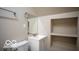 A well-organized bathroom including a toilet, sink vanity, mirror, and convenient shelving at 352 W 28Th St, Indianapolis, IN 46208
