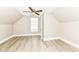 Bright bedroom featuring modern ceiling fan, window, and light hardwood flooring at 352 W 28Th St, Indianapolis, IN 46208