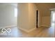 A tranquil bedroom featuring a walk-in closet, neutral decor, and light wood flooring for a modern look at 352 W 28Th St, Indianapolis, IN 46208
