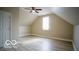 A spacious bedroom with vaulted ceilings, a ceiling fan, and natural light from the window at 352 W 28Th St, Indianapolis, IN 46208
