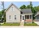 Charming two-story home with a screened-in porch and classic architectural details on a well-maintained lot at 352 W 28Th St, Indianapolis, IN 46208