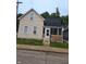 Charming two-story home with siding and an enclosed porch in a residential neighborhood at 352 W 28Th St, Indianapolis, IN 46208