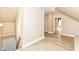 Hallway with stairwell and modern vinyl flooring at 352 W 28Th St, Indianapolis, IN 46208