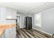 Bright kitchen with stainless steel refrigerator and modern wood-look floors at 352 W 28Th St, Indianapolis, IN 46208