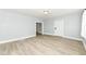 Spacious living room with light gray walls, white trim, light-toned flooring, and recessed lighting at 352 W 28Th St, Indianapolis, IN 46208