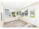 Spacious screened porch with natural light, light-toned plank flooring, and neutral paint at 352 W 28Th St, Indianapolis, IN 46208