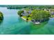 Beautiful aerial view features lakefront home and private dock with watercraft on the lake at 3532 Clearwater Cir, Indianapolis, IN 46240