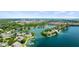 Scenic aerial view showcasing a lakefront community near an urban city with lush greenery at 3532 Clearwater Cir, Indianapolis, IN 46240