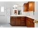 Elegant bathroom boasting granite countertops, custom wood cabinetry, and a large mirror at 3532 Clearwater Cir, Indianapolis, IN 46240