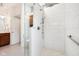 Modern bathroom featuring a glass-enclosed shower with rainfall shower head and tiled walls at 3532 Clearwater Cir, Indianapolis, IN 46240