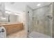 Bright bathroom featuring double sinks, tile flooring, and glass shower at 3532 Clearwater Cir, Indianapolis, IN 46240