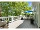 Outdoor deck with patio furniture, BBQ grill, and a serene view of the lake at 3532 Clearwater Cir, Indianapolis, IN 46240