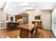 Open dining room with wood table and adjacent kitchen at 3532 Clearwater Cir, Indianapolis, IN 46240