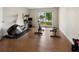 Well-lit exercise room with modern equipment and a scenic outdoor view at 3532 Clearwater Cir, Indianapolis, IN 46240