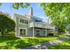 Exterior view of the home features a large deck and green backyard at 3532 Clearwater Cir, Indianapolis, IN 46240