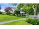 Charming home exterior with a well-manicured lawn, lush landscaping, and a lovely second story deck at 3532 Clearwater Cir, Indianapolis, IN 46240