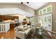 Open concept living room with skylights, dining area, and kitchen at 3532 Clearwater Cir, Indianapolis, IN 46240