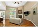 Inviting living room with fireplace and large windows at 3532 Clearwater Cir, Indianapolis, IN 46240