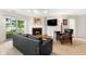 Cozy living room with a fireplace, lake views, and comfortable seating arrangement at 3532 Clearwater Cir, Indianapolis, IN 46240