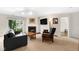 Inviting living room features natural light, a fireplace, and a sleek entertainment setup at 3532 Clearwater Cir, Indianapolis, IN 46240