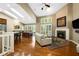Cozy living room featuring a fireplace, skylights and an open layout at 3532 Clearwater Cir, Indianapolis, IN 46240