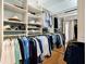 Well-organized walk-in closet with ample storage space, shelving, and mirrored doors at 3532 Clearwater Cir, Indianapolis, IN 46240